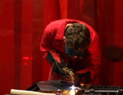 Young person competing in Welding competition