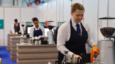 Photo of Collette competing internationally in Restaurant Service Competition