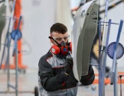 Photo of Conor competing internationally in the Car Painting competition