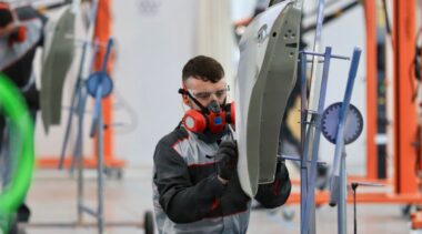 Photo of Conor competing internationally in the Car Painting competition