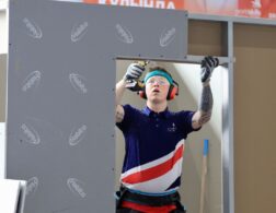 Photo of Curtis competing internationally in the Plastering and Drywall Competition