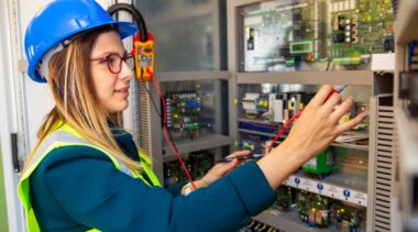 Photo of electrician fixing circuitry