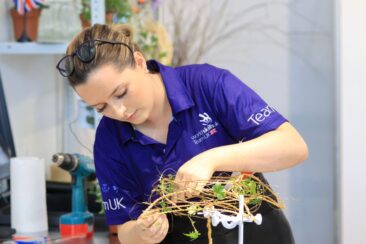 Photo of Elizabeth competing internationally in the Floristry Competition