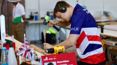 Photo of Owen competing internationally in the cabinet making competition