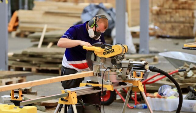 Photo of Shea competing internationally in the landscape gardening competition