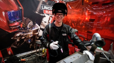 Young person competing in welding competition
