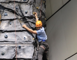 young person rock climbing