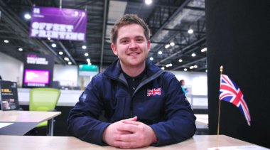 Jon Cleave sitting at desk at WorldSkills London 2011