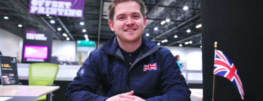 Jon Cleave sitting at desk at WorldSkills London 2011
