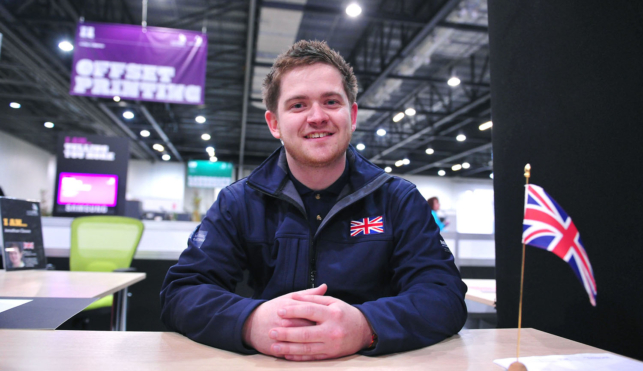 Jon Cleave sitting at desk at WorldSkills London 2011