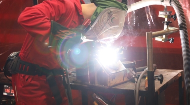 Young person competing in Welding competition