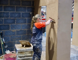 Female plasterer during competition