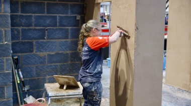 Female plasterer during competition