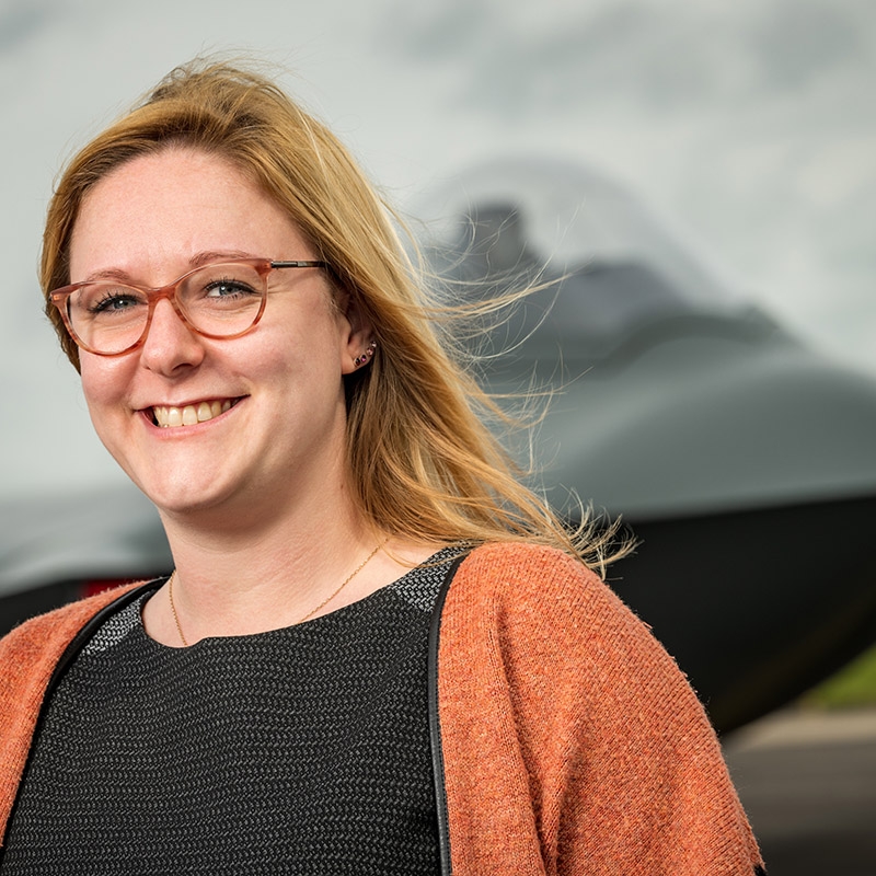 Rachael standing in front of aircraft