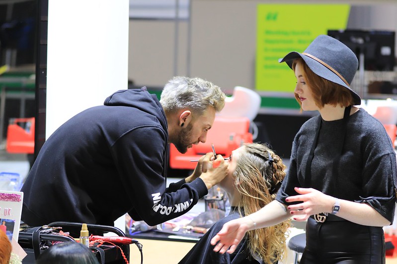 Competitor applying makeup