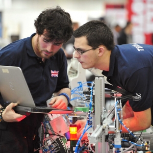 Mark and his teammate Chris looking at a computer