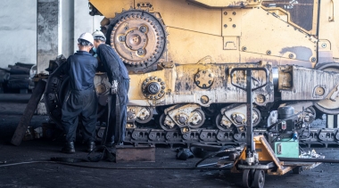 Photo of Heavy machinery maintenance and repair, Mechanic man assembly track link of the bulldozer in coal power plant