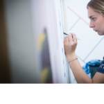 Competitor in action during painting and decorating competition.