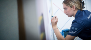 Competitor in action during painting and decorating competition.